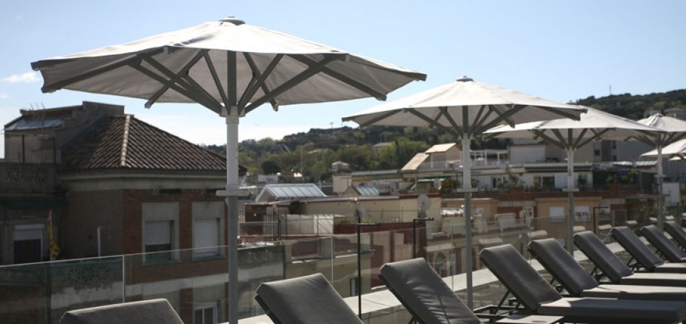 Ibiza parasols lined up on the hotel terrace